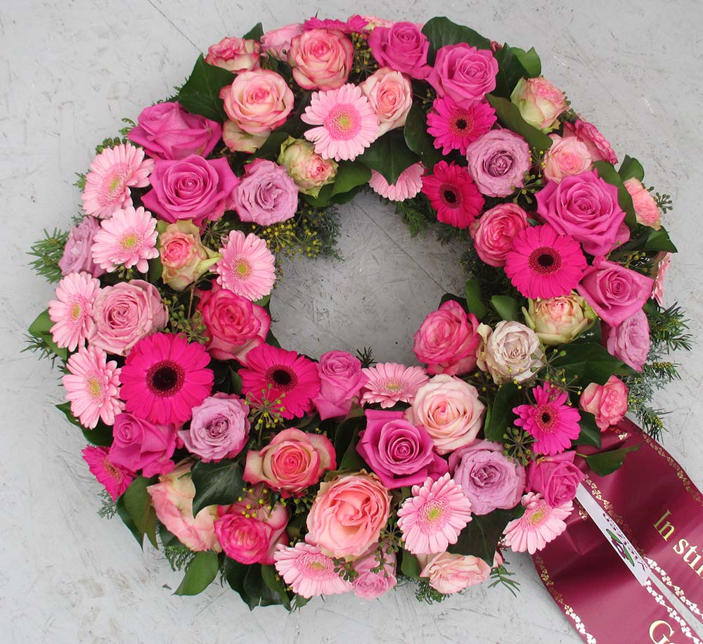 Gärtnerei Vietzen in Ulm | Trauerfloristik Kränze rosa und pinke Blumen