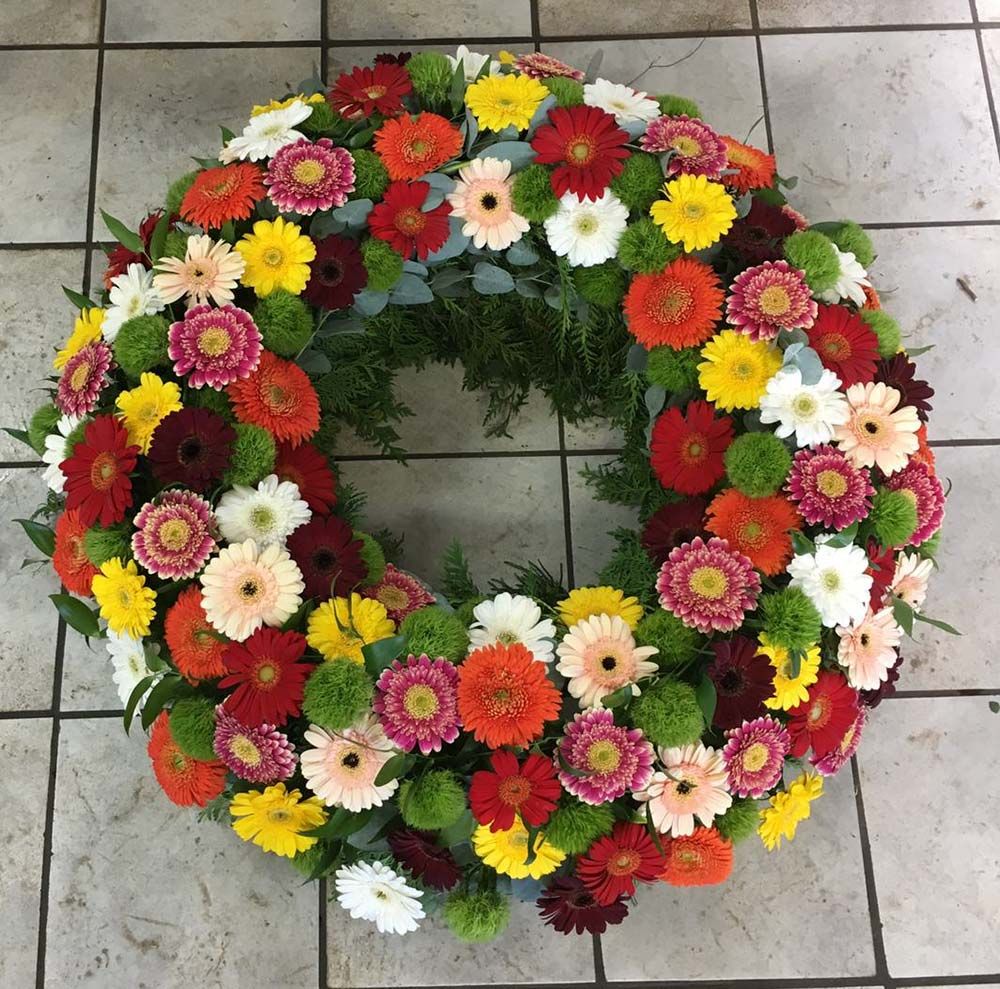 Gärtnerei Vietzen in Ulm | Trauerfloristik Kränze bunte Gerbera