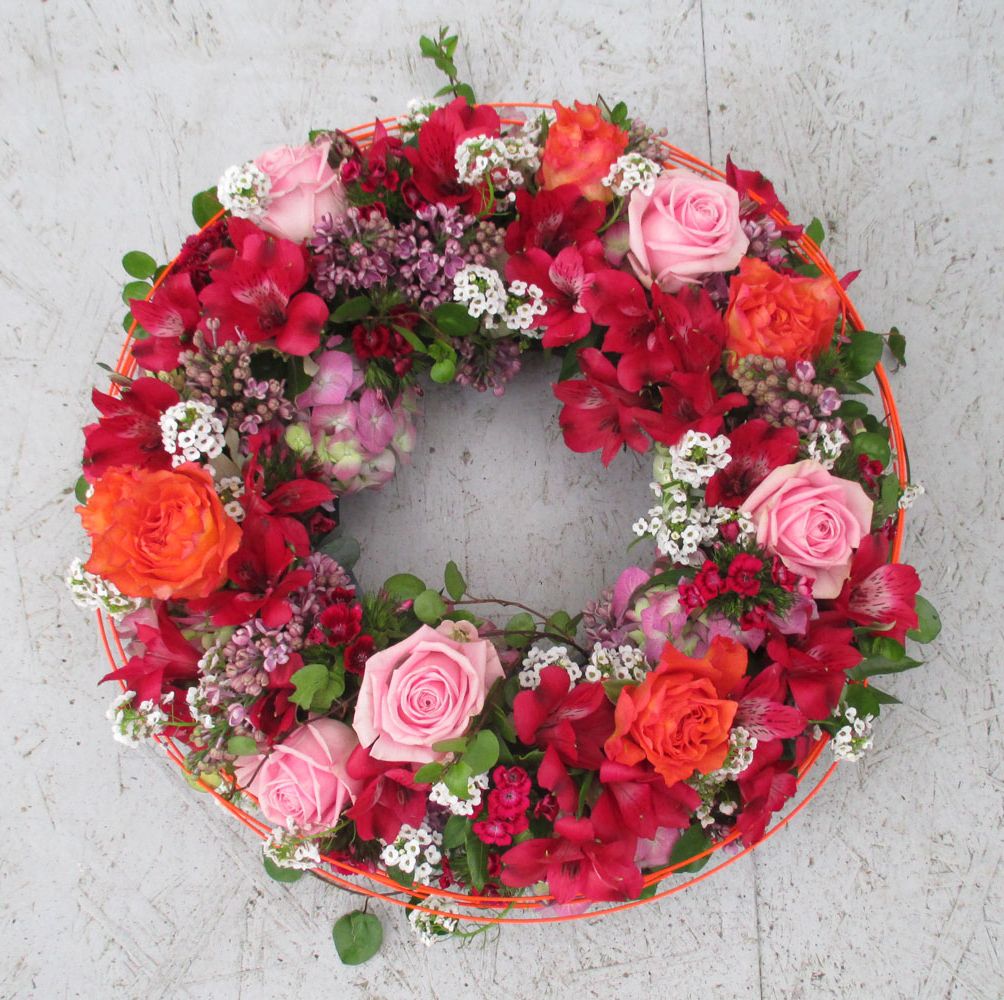 Gärtnerei Vietzen in Ulm Trauerfloristik Urnenschmuck rot/rosa
